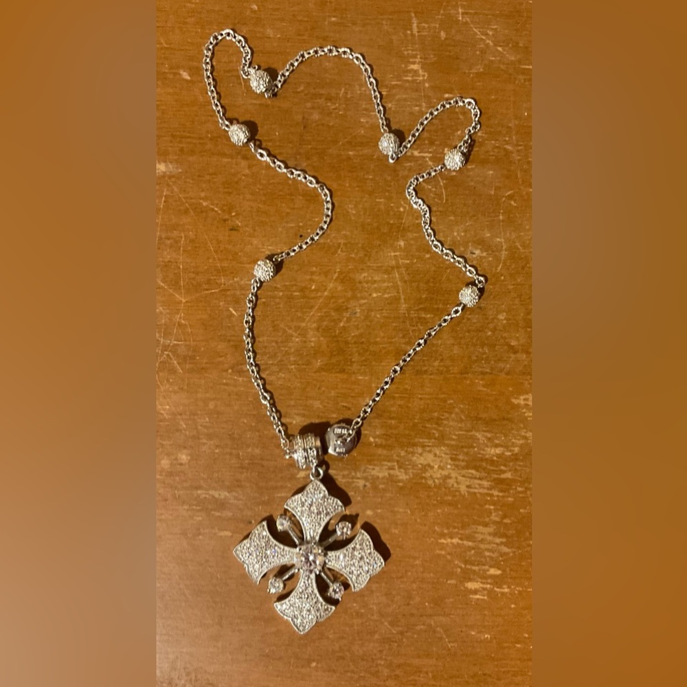 Joseph Esposito: Maltese cross sterling silver magnetic pendant and necklace.